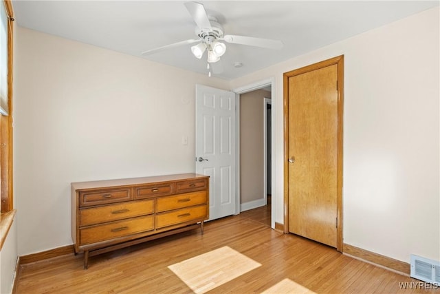 bedroom with ceiling fan and light hardwood / wood-style flooring