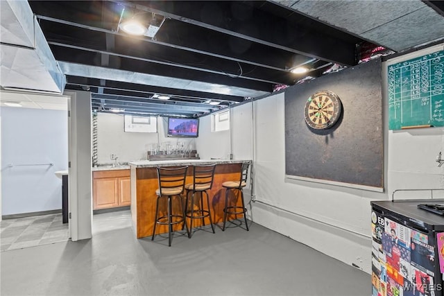 bar featuring concrete floors