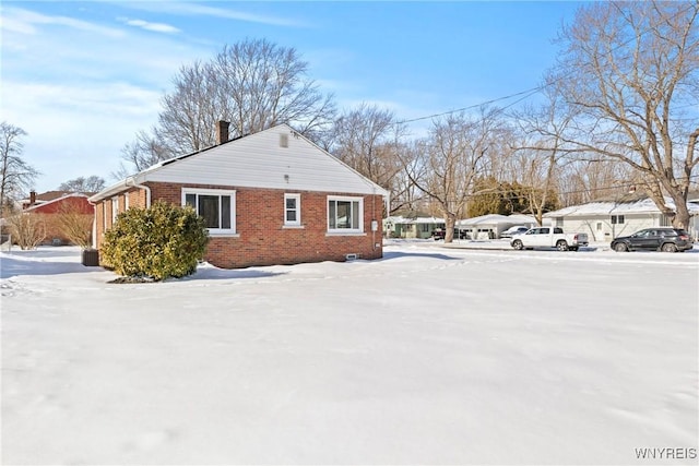 view of snow covered property