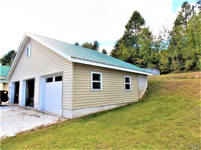 garage with a yard