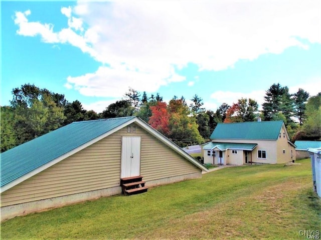 back of property featuring a yard