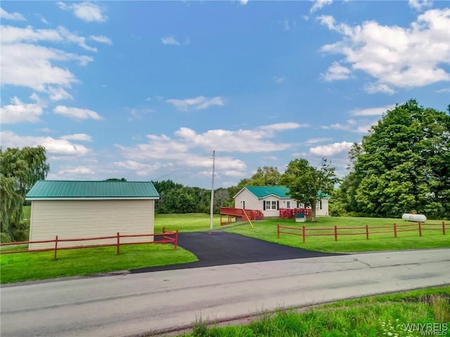 view of home's community with a yard