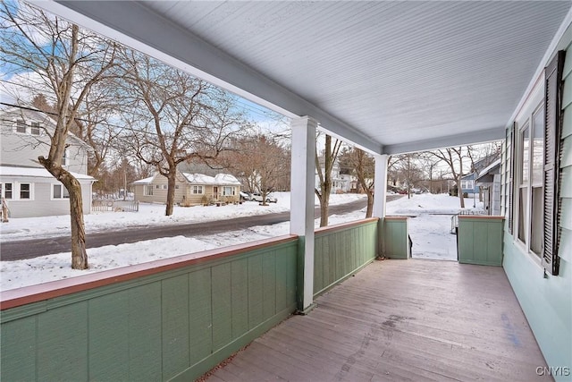 view of snow covered deck