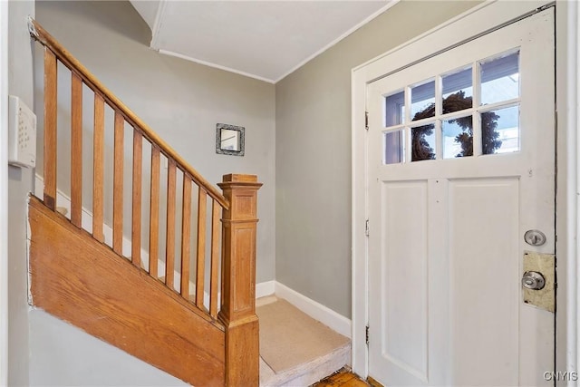 entrance foyer featuring ornamental molding