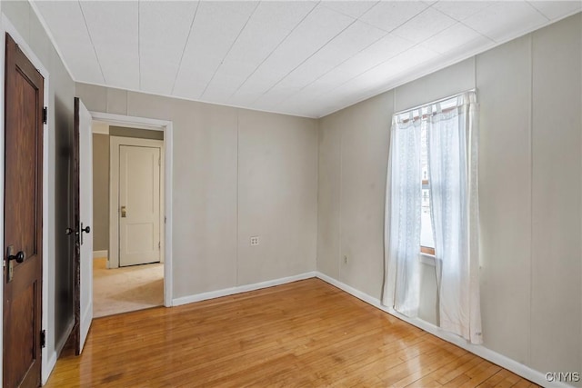 unfurnished room featuring light hardwood / wood-style floors