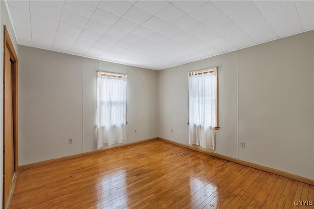 unfurnished room with light hardwood / wood-style flooring