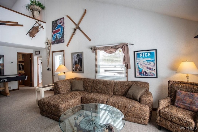 living room with carpet floors and a towering ceiling