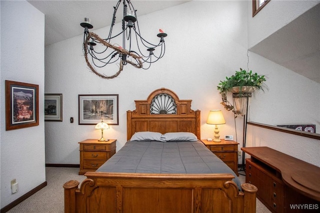 carpeted bedroom with a notable chandelier