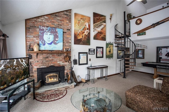 carpeted living room featuring lofted ceiling, a fireplace, and ceiling fan