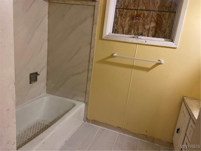 bathroom featuring a bath and tile patterned floors