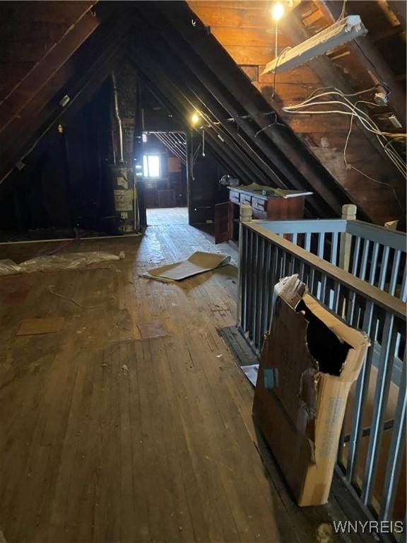 unfinished attic featuring gas water heater