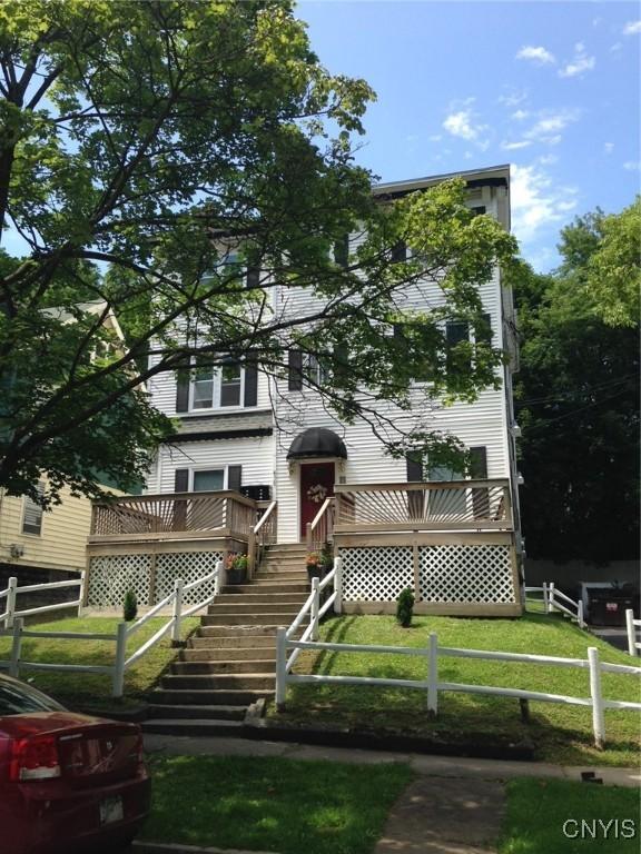 430 Columbus Ave, Syracuse, NY 13210 - view of front facade with a wooden deck