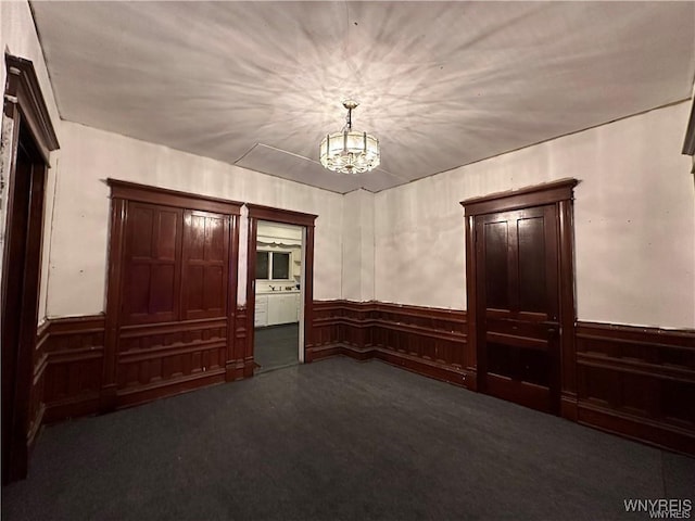 empty room with dark carpet