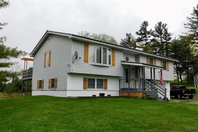 raised ranch featuring a front lawn