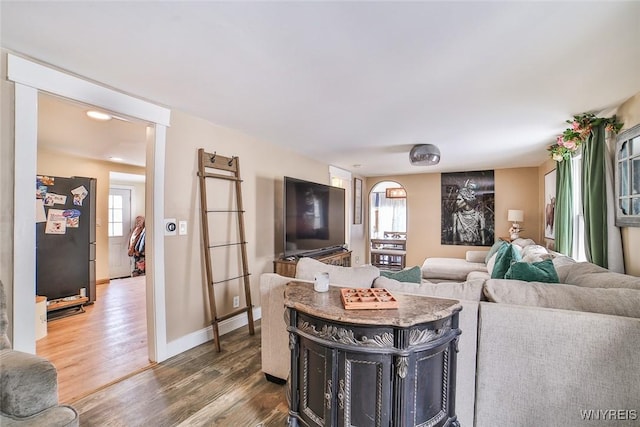 living room with dark hardwood / wood-style floors