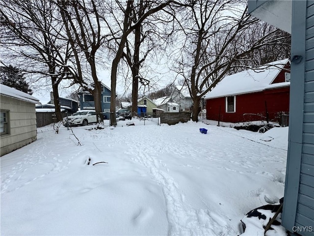 view of yard layered in snow