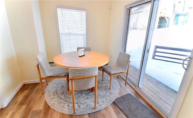 dining room with light wood-type flooring