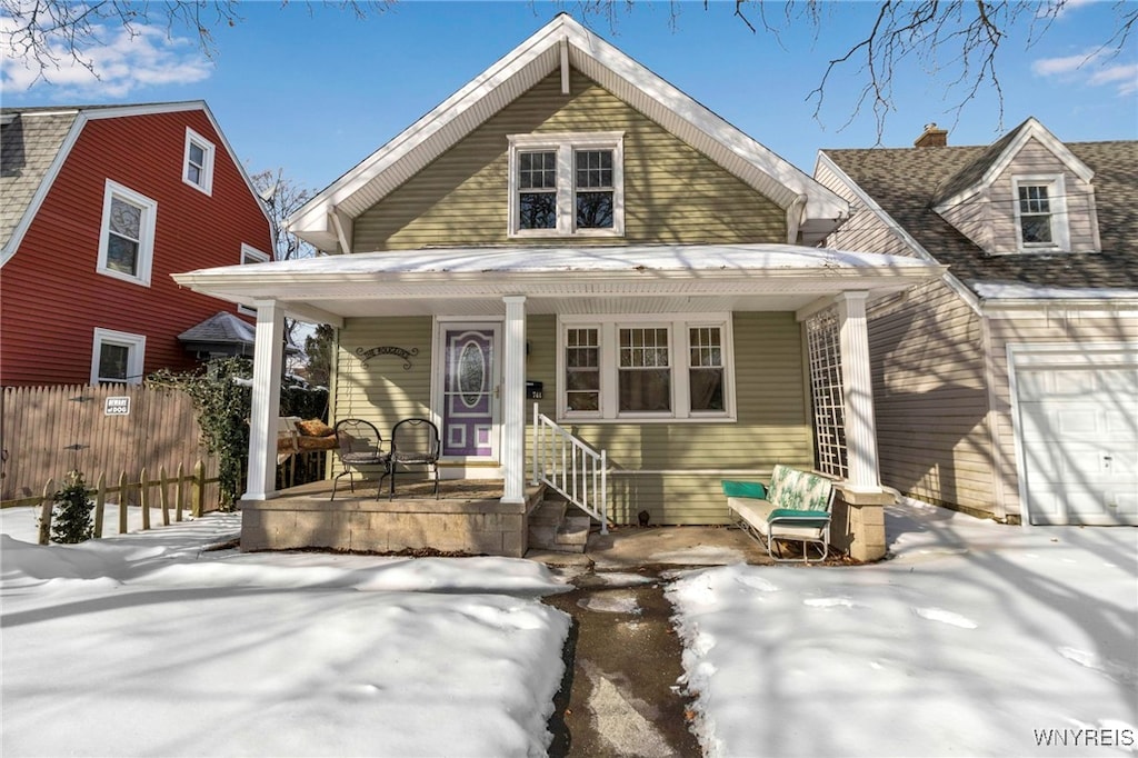 view of front of home featuring a garage and covered porch