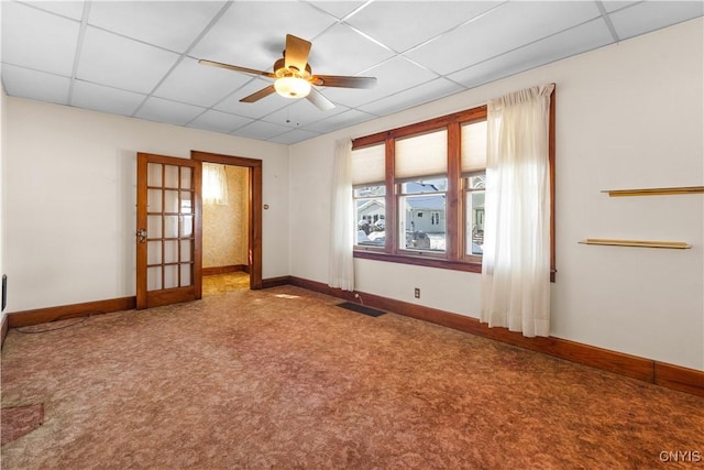 1407 Downer Ave, Utica, NY 13502 - empty room with a paneled ceiling, a ceiling fan, carpet floors, and french doors