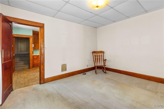1407 Downer Ave, Utica, NY 13502 - carpeted spare room with baseboards and a paneled ceiling