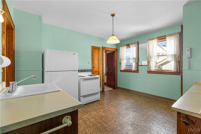 1407 Downer Ave, Utica, NY 13502 - kitchen with white appliances, light countertops, decorative light fixtures, and light floors