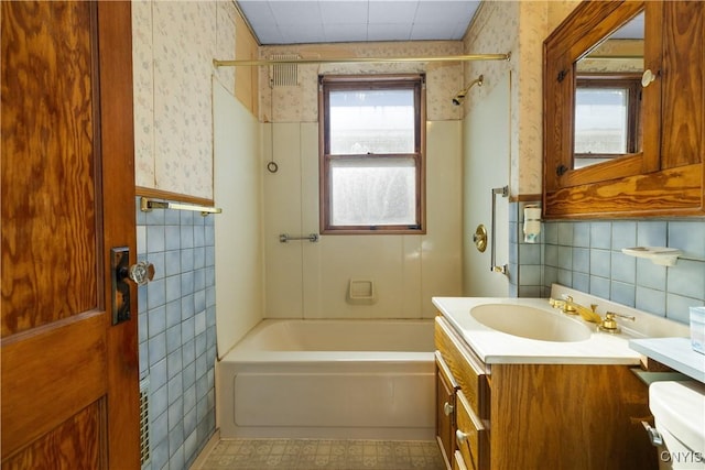 1407 Downer Ave, Utica, NY 13502 - full bathroom featuring wallpapered walls, tub / shower combination, vanity, and tile walls