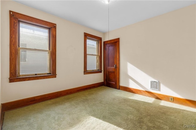 1407 Downer Ave, Utica, NY 13502 - carpeted spare room featuring baseboards