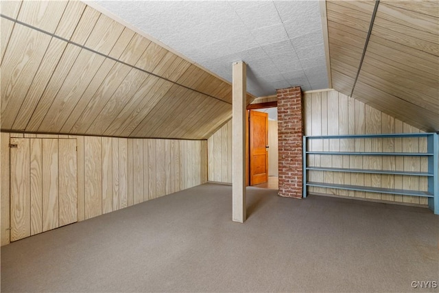 1407 Downer Ave, Utica, NY 13502 - additional living space with wooden walls, carpet floors, and lofted ceiling