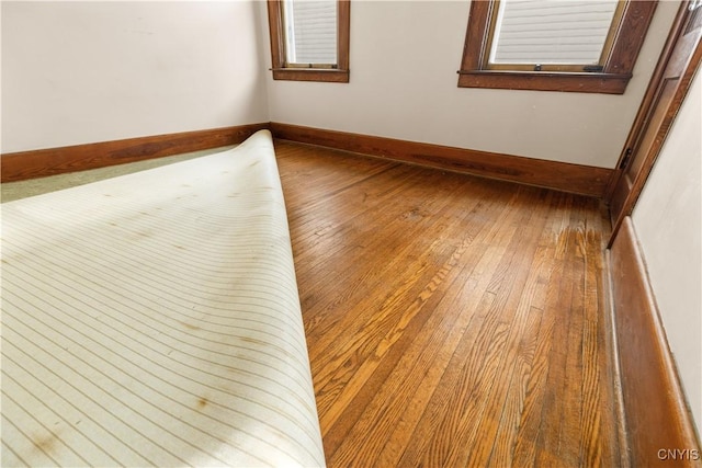 1407 Downer Ave, Utica, NY 13502 - unfurnished room with hardwood / wood-style flooring and baseboards