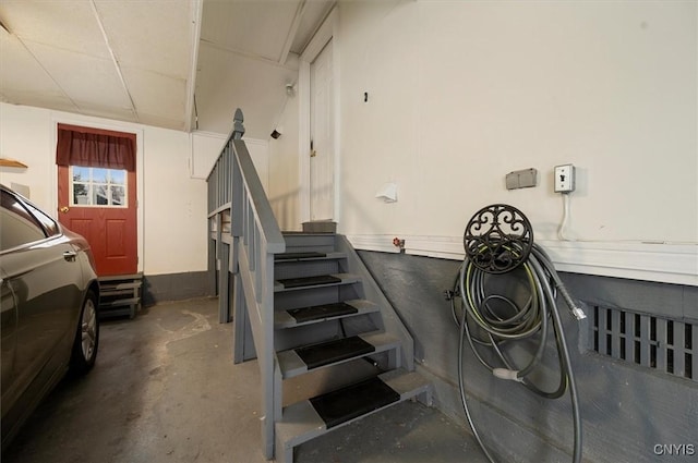 stairs with concrete flooring