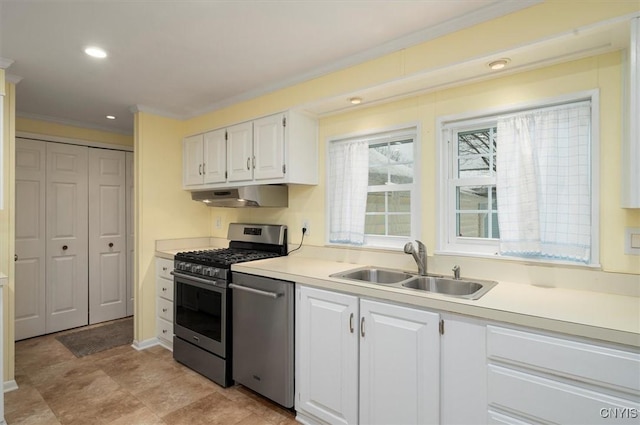 kitchen with white cabinetry, appliances with stainless steel finishes, crown molding, and sink