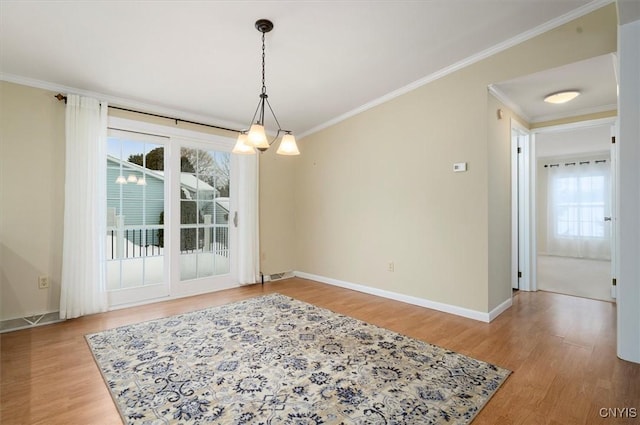 dining space featuring wood-type flooring and ornamental molding