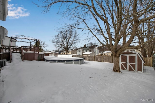 yard covered in snow featuring a gazebo