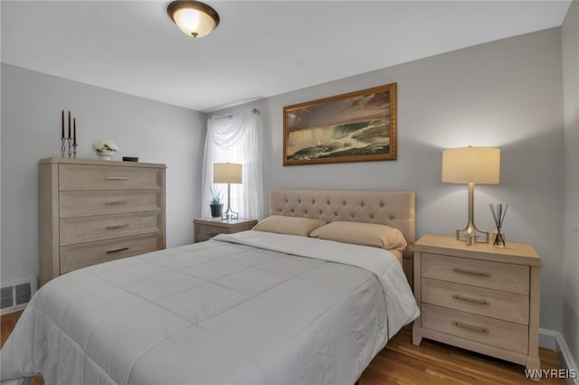 bedroom with wood-type flooring