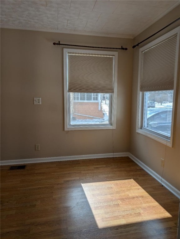 empty room featuring dark wood-type flooring