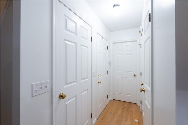 hall with light hardwood / wood-style floors