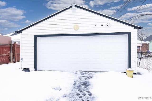 view of snow covered garage