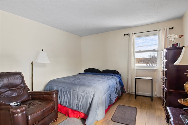 bedroom with light hardwood / wood-style flooring