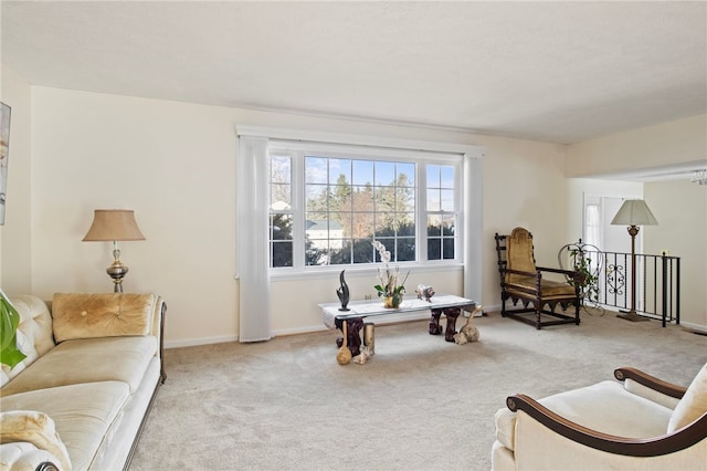 living area featuring light colored carpet