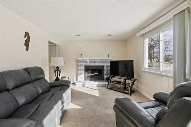 carpeted living room featuring a fireplace and a textured ceiling