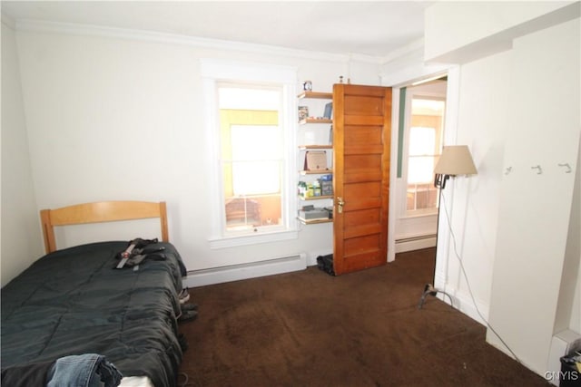 carpeted bedroom featuring crown molding and a baseboard heating unit