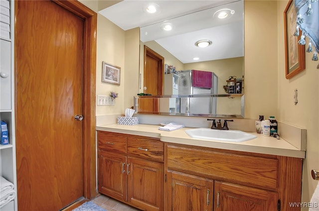 bathroom featuring tile patterned flooring and vanity