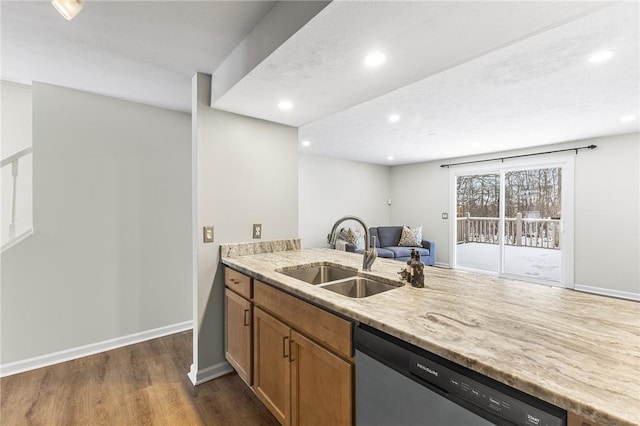 kitchen with dishwasher, sink, and dark hardwood / wood-style floors