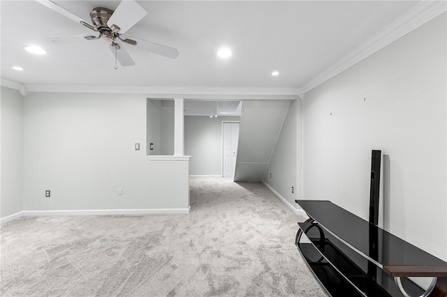 interior space with ornamental molding and ceiling fan