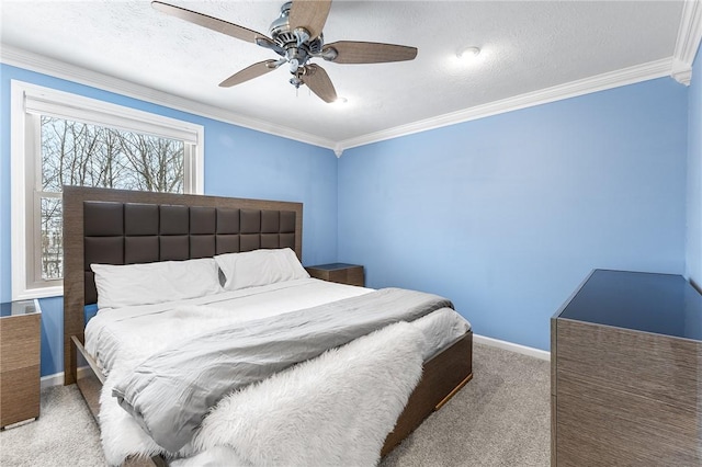 carpeted bedroom with ceiling fan, ornamental molding, and a textured ceiling