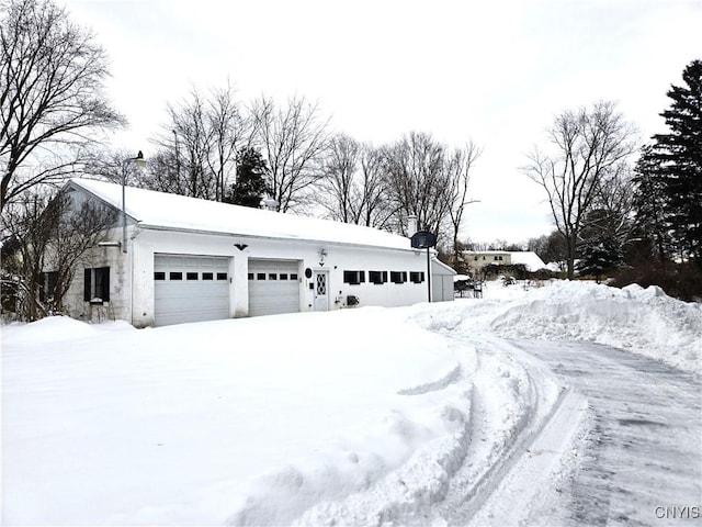 view of snow covered garage
