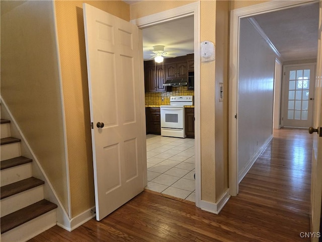 corridor with light hardwood / wood-style floors