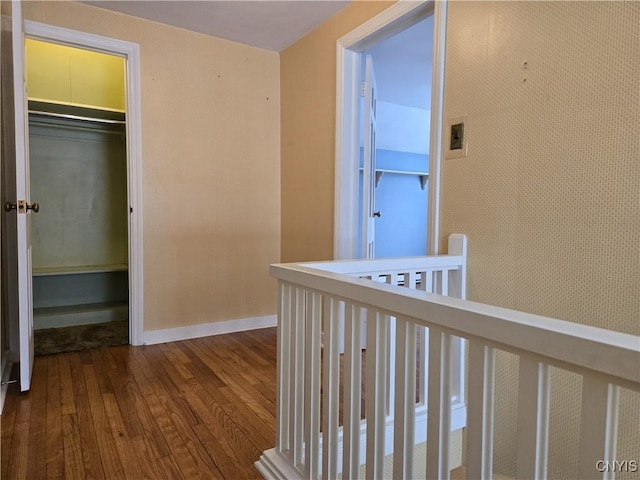 corridor featuring hardwood / wood-style floors