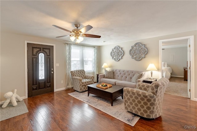 living room featuring hardwood / wood-style floors and ceiling fan