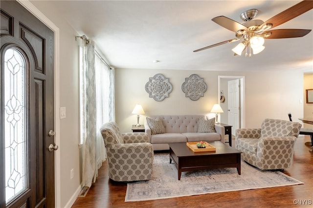 living room with hardwood / wood-style flooring, a healthy amount of sunlight, and ceiling fan